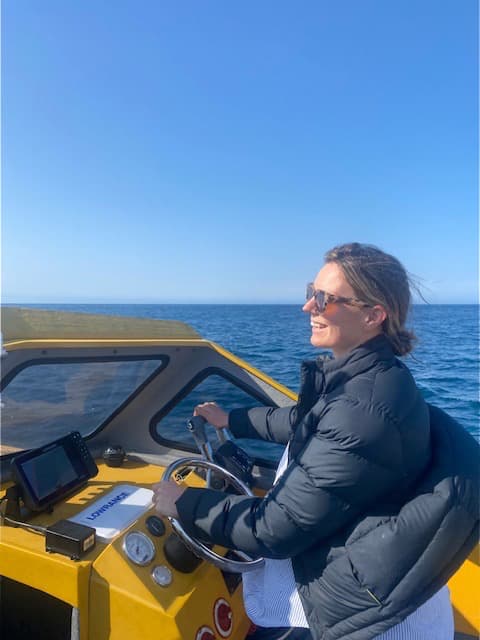 Boat captain Kirsty navigating